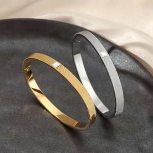 Textured stainless steel open bangles with square shell inlay in gold and silver finish