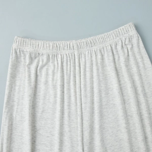Detail of high-elastic wide waistband on heather grey cotton knit casual trousers
