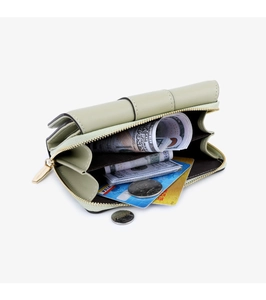 Detail view of light green litchi grain wallet showing cash and card compartments