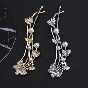 Elegant gold and silver butterfly hair clips with sparkling rhinestones and pearls