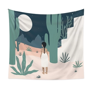 Detail of bohemian tapestry featuring desert night illustration with cacti and stars