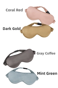 Detail of 22 momme mulberry silk eye masks in coral, gold, grey, and mint green