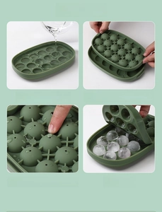 Detail of 18-grid green ice ball mold showing filling water and sealing steps