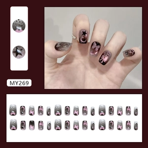 Cat eye gradient press-on nails with star moon patterns and smile letter accents