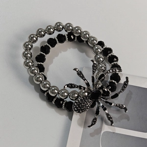 Gothic punk bracelet featuring black spider charm and silver metal beads for men
