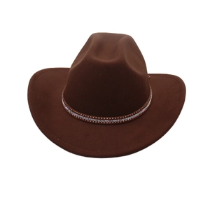 Detail of dark brown western cowboy hat with rhinestone and gold stud decorative band