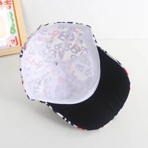 Detail view of the breathable white lining and printed fabric of the children baseball cap