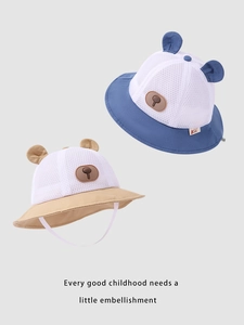 Detail of baby sun hats in navy and beige featuring breathable mesh and bear ears