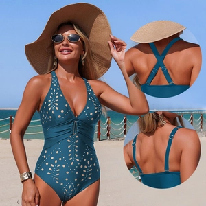 Teal laser-cut one-piece swimsuit with V-neck, buckle detail, and multi-way straps