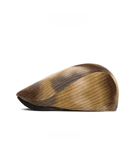 Side view of a vintage knitted flat cap with brown tie-dye stripes and warm texture