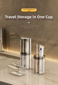 Close-up of a translucent grey travel toothbrush case on a luxury marble countertop