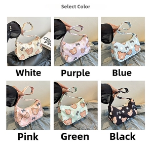 Detail showing cartoon bear shoulder bags in white, purple, blue, pink, green, and black