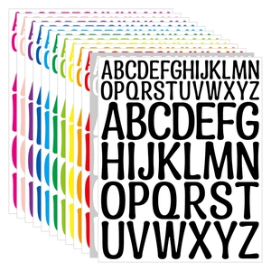 Macro view of 10-color alphabet vinyl stickers stacked in a fan layout on white background