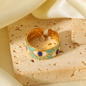 Adjustable evil eye gold plated stainless steel ring with blue enamel detailing