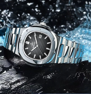 Macro shot of waterproof black dial watch on wet rock with dynamic water splashes