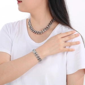 Detailed view of 13mm silver polished stainless steel Cuban chain necklace and bracelet set