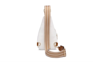 Detail of white pebbled leather sling bag with gold hardware and geometric woven strap