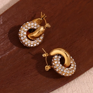 Macro detail of 18K gold plated donut hoop earrings with sparkling micro-inlaid rhinestones