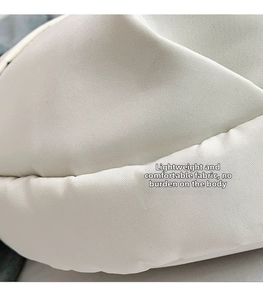 Detailed macro view of the cream white high-density fabric on this stylish tote bag