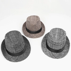Detailed overhead view of three classic plaid fedora hats in various neutral colors