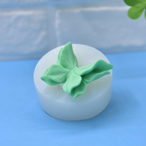 DIY butterfly silicone mold with detailed green butterfly wings for cake decorating