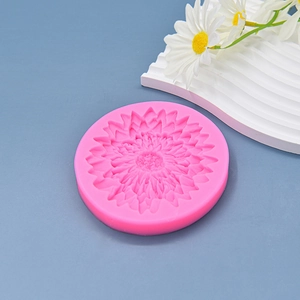 Pink silicone sunflower mold for DIY baking and cake fondant on a blue background