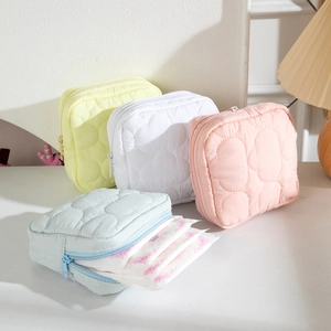 Quilted cream cloud travel pouch for sanitary napkins in four soft pastel colors