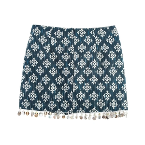 Ethnic blue printed mini skirt with white geometric patterns and bead embellishments