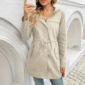 Detail of light beige hooded windbreaker with drawstring waist and metal zipper closure
