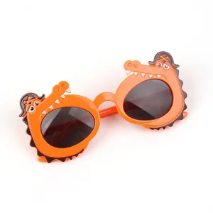 Close-up of cute orange crocodile sunglasses for kids with pirate hat design details