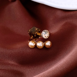Macro detail of hexagonal crystal, champagne zircon and pearls on a silver ring