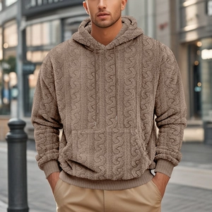 Close-up of brown textured teddy fleece fabric on men's hoodie with hood drawstring details