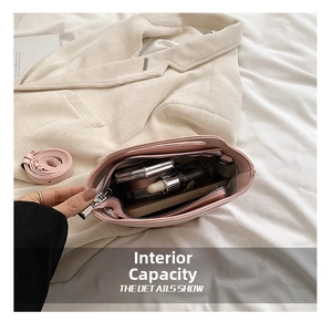 Detail showing the internal capacity of the pink bucket bag for daily essentials