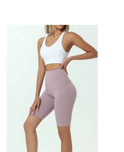 Close-up of high-waist yoga shorts showing flexible fabric and shaping effect