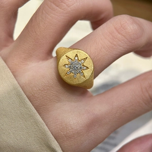 Gold plated star signet ring with micro-set zircons and brushed texture finish