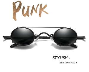 Detail of punk style sunglasses with black metal oval frames and dual bridge structure