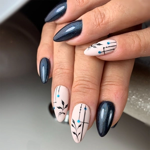 Peacock green glitter almond fake nails with black leaf hand-painted designs and accents