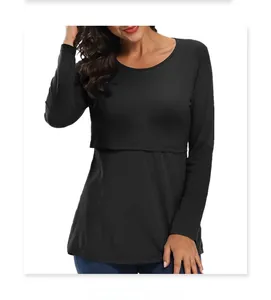 Detail of the layered nursing access design on a black cotton long-sleeve maternity top