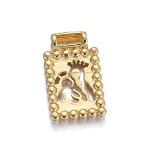 Macro shot of gold-plated rectangular locket with hollow crown figure and beaded edges