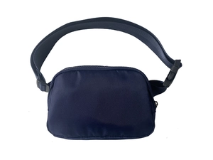Detail of navy blue waterproof nylon waist bag showing adjustable strap and plastic buckle