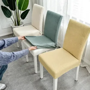 Thick waffle stretch chair covers in cream and green for dining chair protection