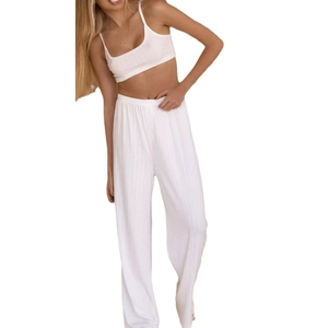 Three-piece white knit loungewear set with a crop camisole top and wide-leg trousers