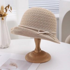 Elegant beige woven sun hat with bow detail and breathable hollow texture for women