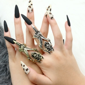 Detail of gothic articulated skull armor ring with movable mechanical metal joints