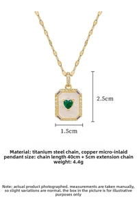 Detail of square shell pendant with green heart stone and white crystal border