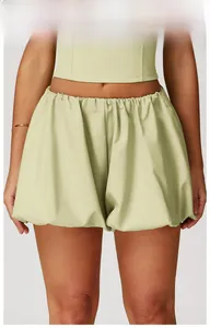 Mustard green high-waist fitness shorts and crop top set with ruched fabric detail