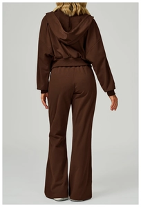 Detail view of deep brown oversized hoodie and wide-leg jogger set with soft fleece texture