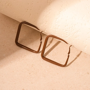 Detailed view of large square geometric hoop earrings in a coffee brown matte finish