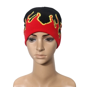 Knitted beanie with red and yellow flame pattern on black background for hip hop style