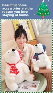 Detail of soft plush polar bears with Christmas hats and scarves in two sizes